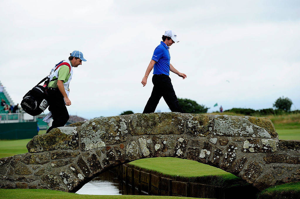 Rory McIlroy walks across the Swilcan Bridge at St Andrews